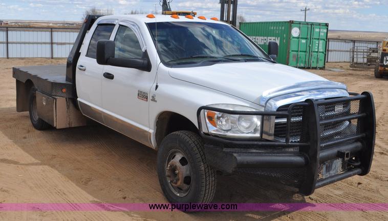 image for item F2352 2007 Dodge Ram 3500 Quad Cab flatbed truck