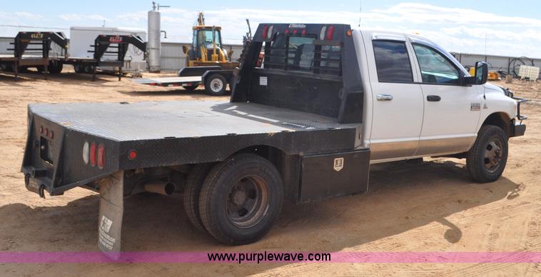 image for item F2352 2007 Dodge Ram 3500 Quad Cab flatbed truck