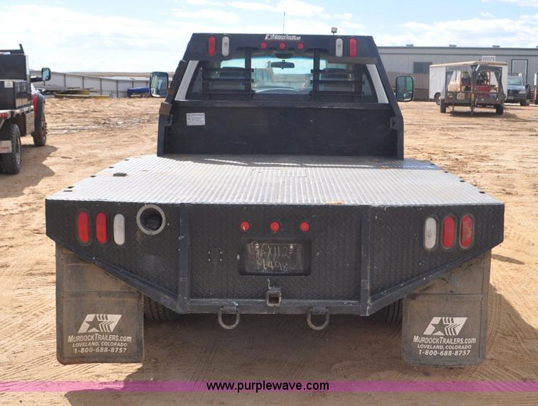 image for item F2352 2007 Dodge Ram 3500 Quad Cab flatbed truck