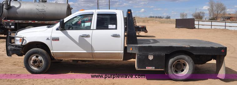 image for item F2352 2007 Dodge Ram 3500 Quad Cab flatbed truck