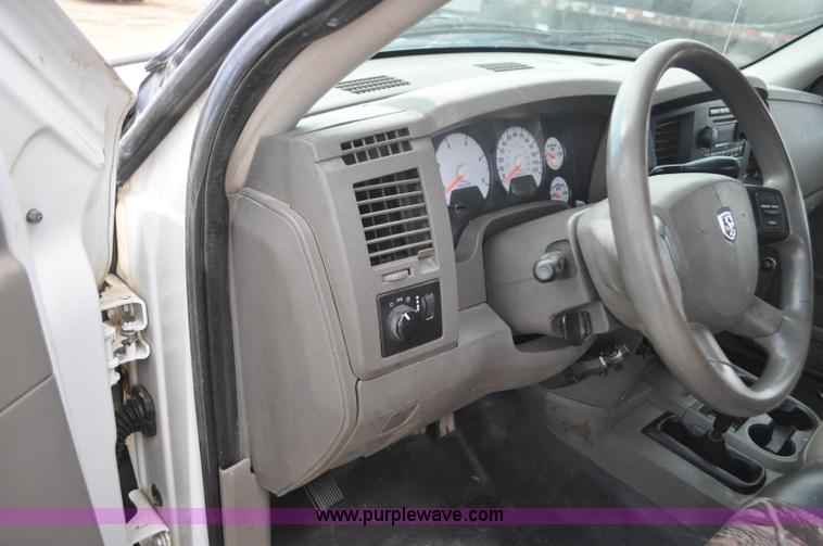 image for item F2352 2007 Dodge Ram 3500 Quad Cab flatbed truck