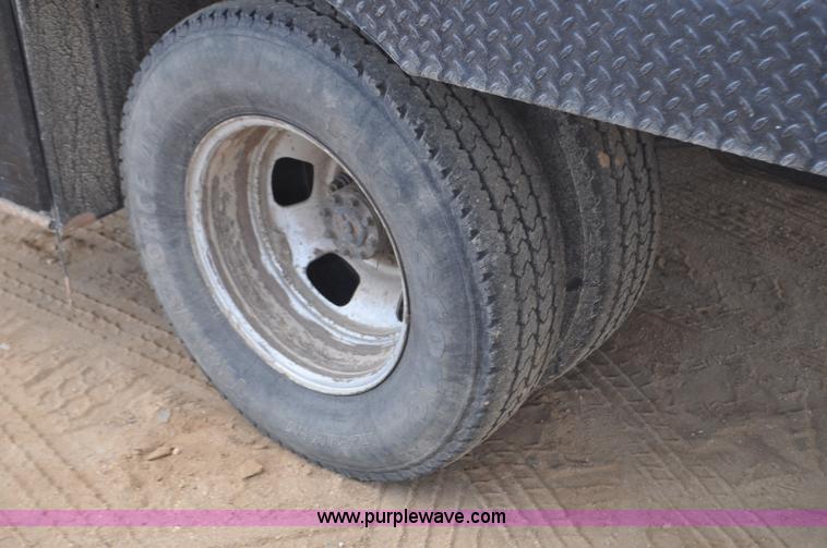 image for item F2352 2007 Dodge Ram 3500 Quad Cab flatbed truck