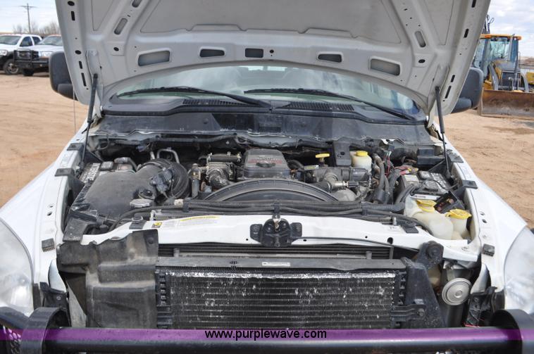 image for item F2352 2007 Dodge Ram 3500 Quad Cab flatbed truck