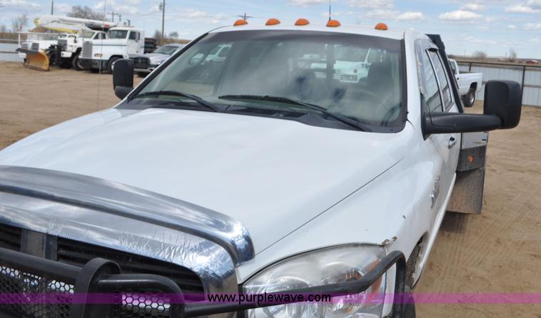 image for item F2352 2007 Dodge Ram 3500 Quad Cab flatbed truck