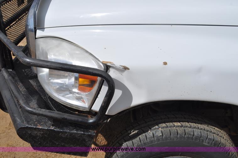 image for item F2352 2007 Dodge Ram 3500 Quad Cab flatbed truck