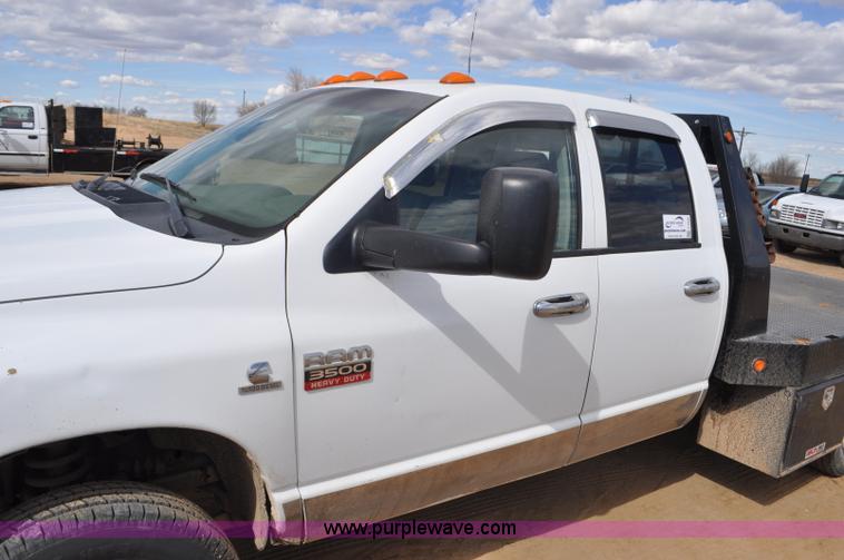 image for item F2352 2007 Dodge Ram 3500 Quad Cab flatbed truck