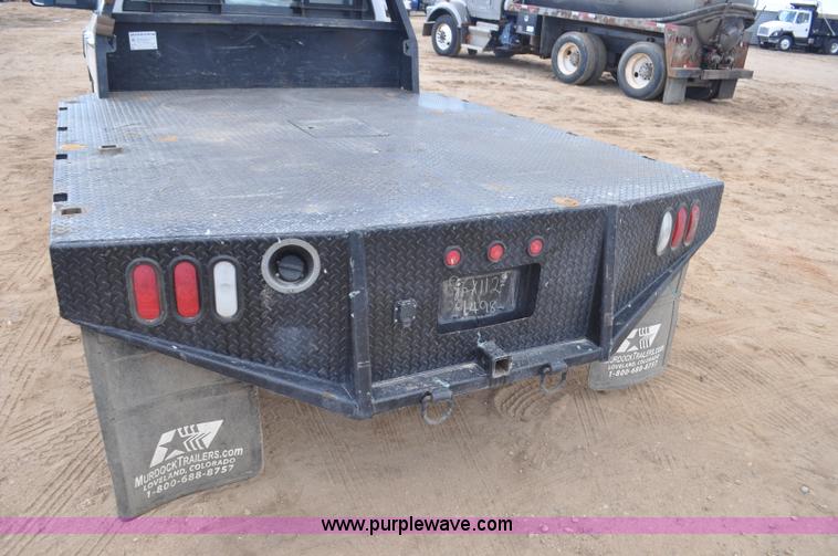 image for item F2352 2007 Dodge Ram 3500 Quad Cab flatbed truck