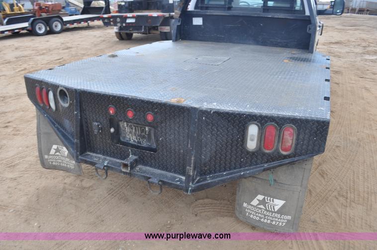 image for item F2352 2007 Dodge Ram 3500 Quad Cab flatbed truck