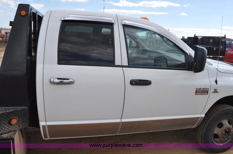 image for item F2352 2007 Dodge Ram 3500 Quad Cab flatbed truck
