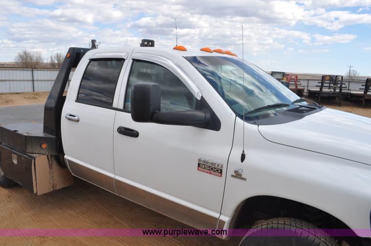 image for item F2352 2007 Dodge Ram 3500 Quad Cab flatbed truck