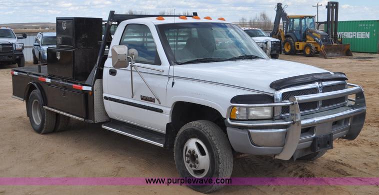 image for item F2353 1999 Dodge Ram 3500 Laramie SLT flatbed truck