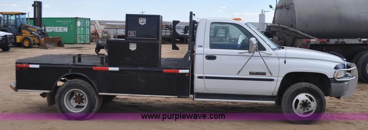 image for item F2353 1999 Dodge Ram 3500 Laramie SLT flatbed truck