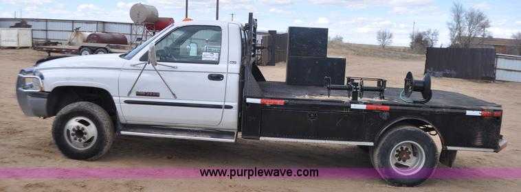 image for item F2353 1999 Dodge Ram 3500 Laramie SLT flatbed truck