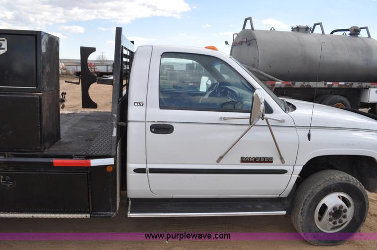 image for item F2353 1999 Dodge Ram 3500 Laramie SLT flatbed truck