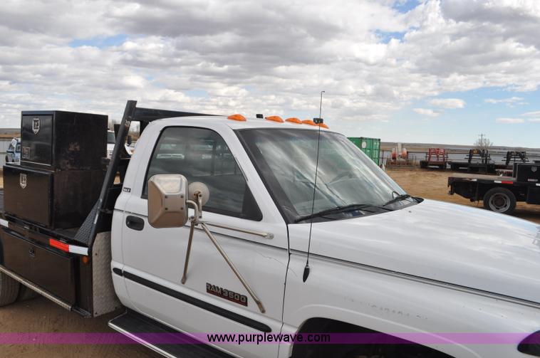 image for item F2353 1999 Dodge Ram 3500 Laramie SLT flatbed truck