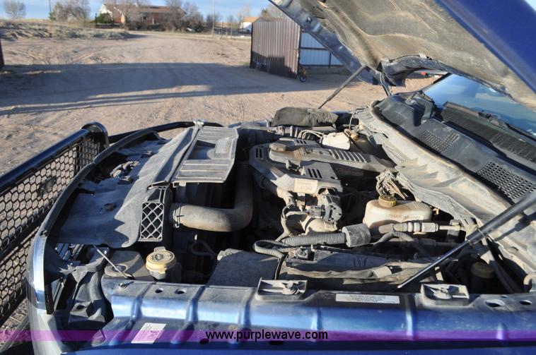 image for item F2375 2010 Dodge Ram 3500 Quad Cab flatbed truck