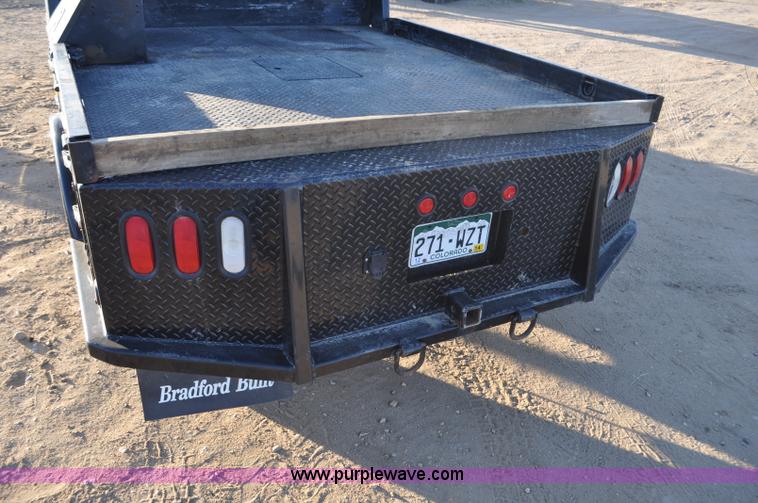 image for item F2375 2010 Dodge Ram 3500 Quad Cab flatbed truck
