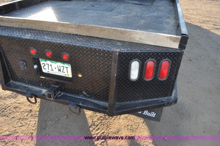 image for item F2375 2010 Dodge Ram 3500 Quad Cab flatbed truck