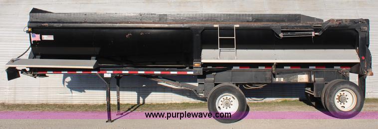 image for item K8769 2002 Travis barrel bed end dump trailer