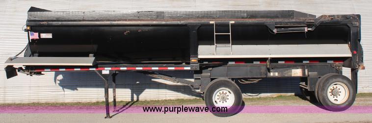 image for item K8769 2002 Travis barrel bed end dump trailer