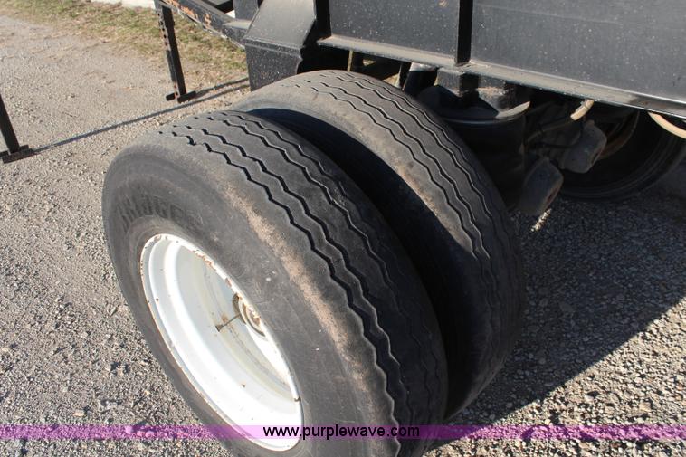 image for item K8769 2002 Travis barrel bed end dump trailer