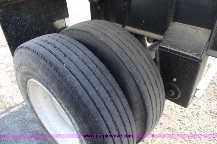 image for item K8769 2002 Travis barrel bed end dump trailer