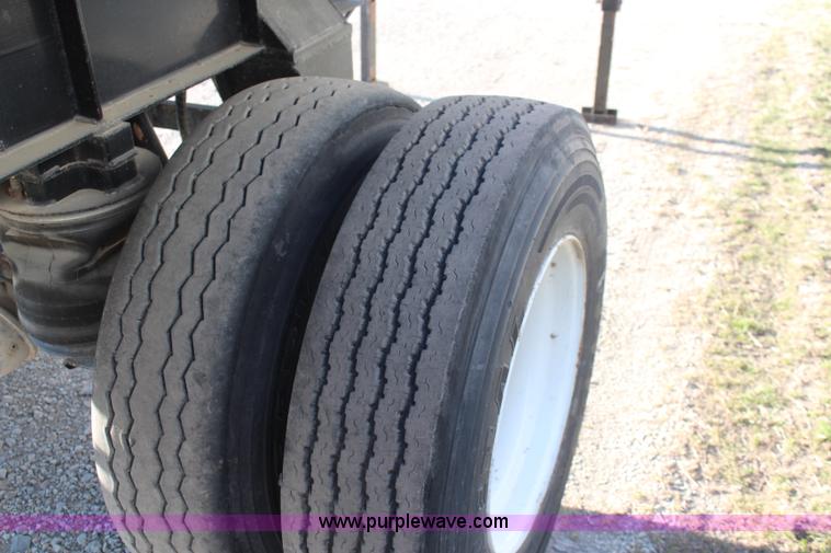 image for item K8769 2002 Travis barrel bed end dump trailer