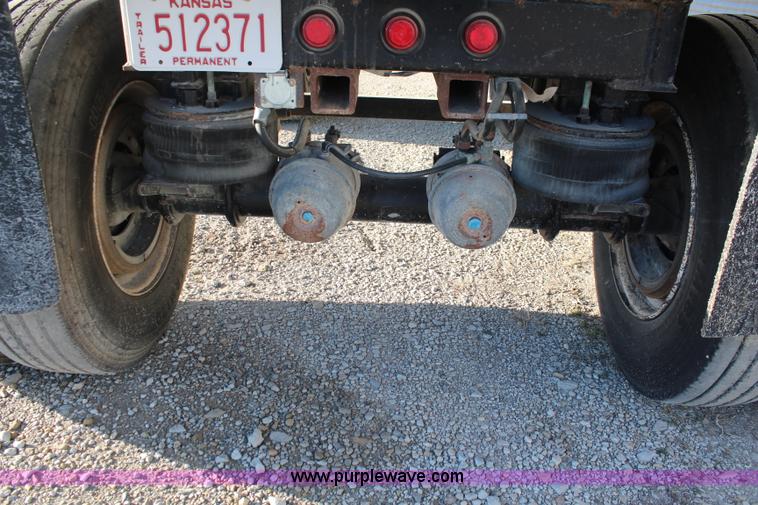 image for item K8769 2002 Travis barrel bed end dump trailer