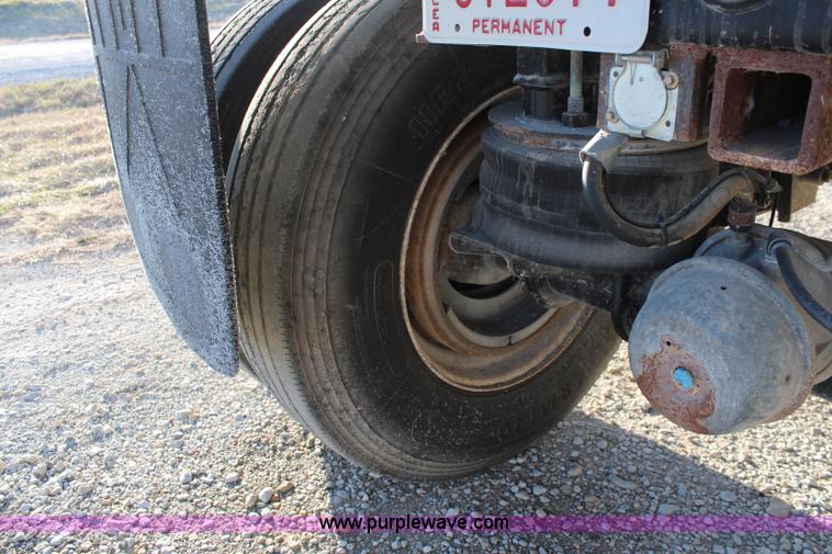 image for item K8769 2002 Travis barrel bed end dump trailer