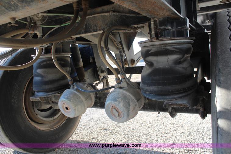 image for item K8769 2002 Travis barrel bed end dump trailer