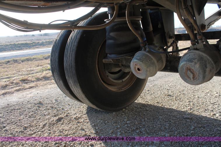 image for item K8769 2002 Travis barrel bed end dump trailer