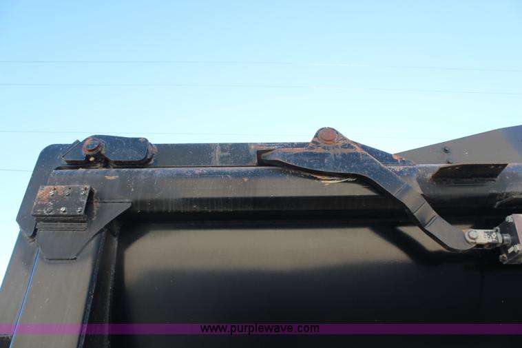 image for item K8769 2002 Travis barrel bed end dump trailer