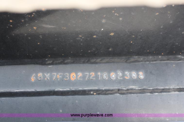 image for item K8769 2002 Travis barrel bed end dump trailer