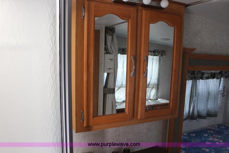 image for item F7633 2005 All American Sport fifth wheel toy hauler camper