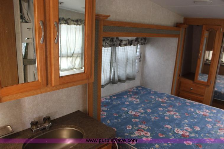 image for item F7633 2005 All American Sport fifth wheel toy hauler camper