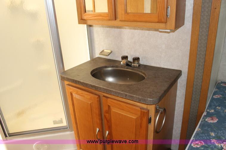 image for item F7633 2005 All American Sport fifth wheel toy hauler camper