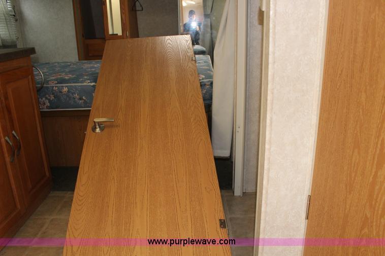 image for item F7633 2005 All American Sport fifth wheel toy hauler camper