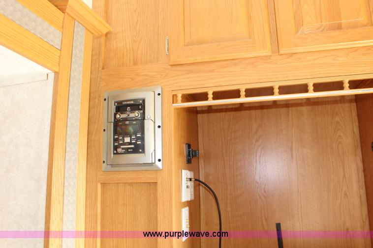 image for item F7633 2005 All American Sport fifth wheel toy hauler camper