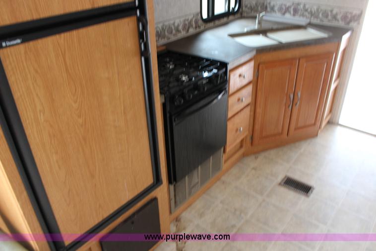 image for item F7633 2005 All American Sport fifth wheel toy hauler camper