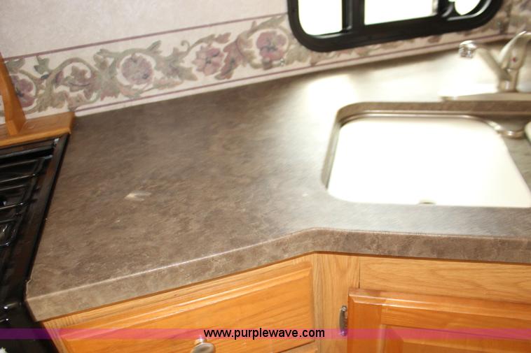 image for item F7633 2005 All American Sport fifth wheel toy hauler camper