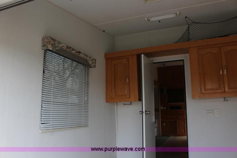 image for item F7633 2005 All American Sport fifth wheel toy hauler camper