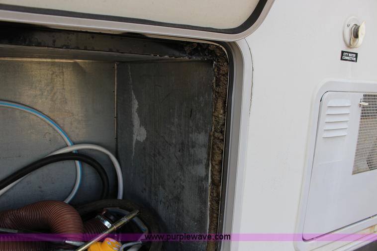 image for item F7633 2005 All American Sport fifth wheel toy hauler camper