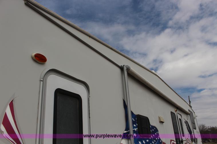 image for item F7633 2005 All American Sport fifth wheel toy hauler camper