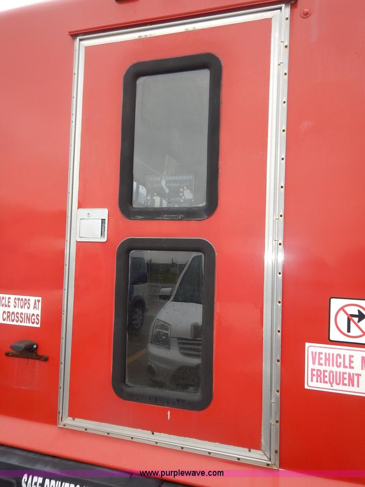 image for item J3990 2000 Ford 801 transit bus