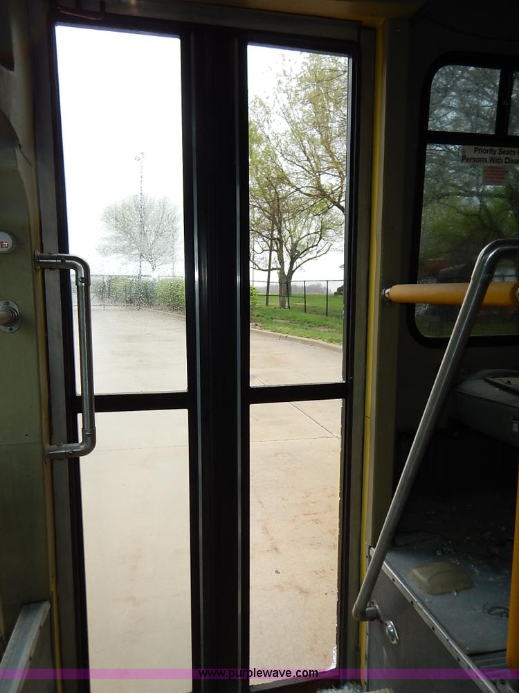 image for item J3998 2002 Ford 801 Diamond Coach transit bus