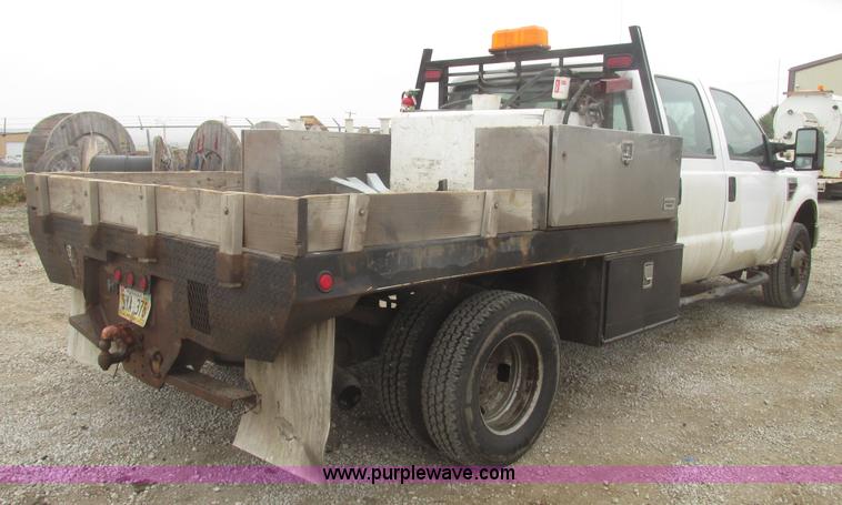 image for item H4682 2008 Ford F350 Super Duty XL Crew Cab flatbed truck