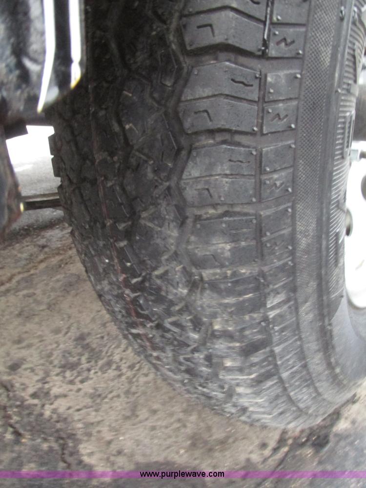 image for item H4686 2014 Lamar tilt deck trailer