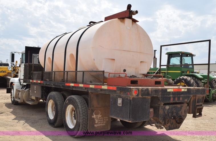 image for item H5215 1999 Freightliner FLD120 flatbed truck