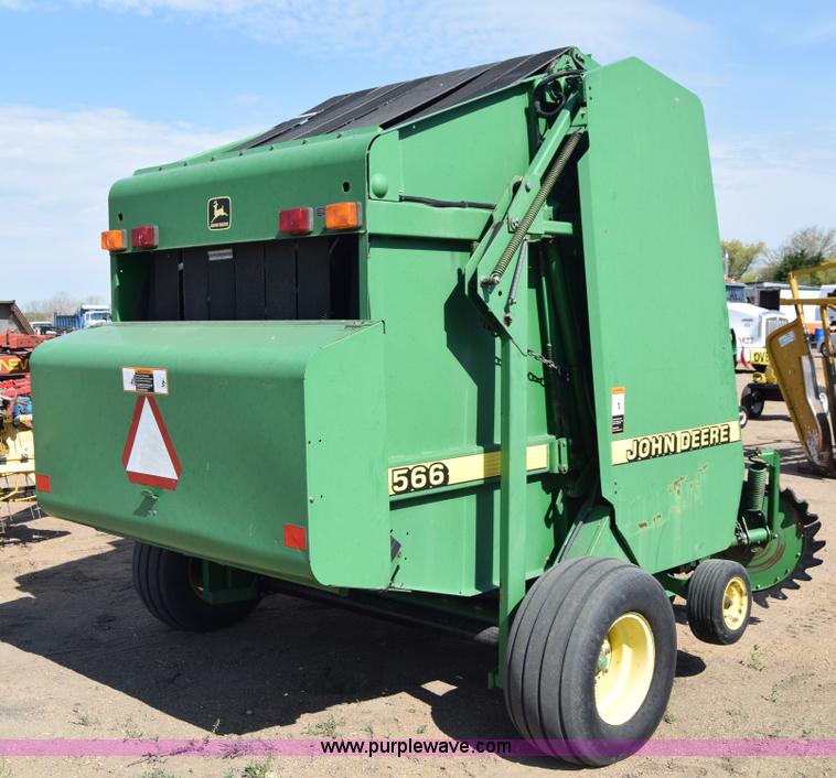 image for item H8619 1998 John Deere 566 round baler