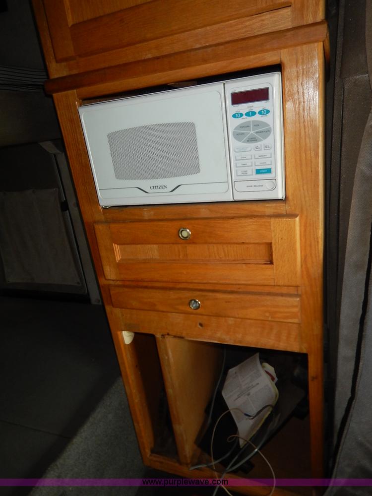 image for item K7392 2000 Freightliner FL70 semi truck